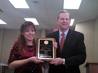 Florio is presented award