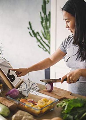 Woman preparing a meal in kitchen