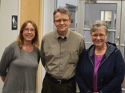 Web manager Thor Carlson flanked by Ellen and Marge. Photo: John Williams.