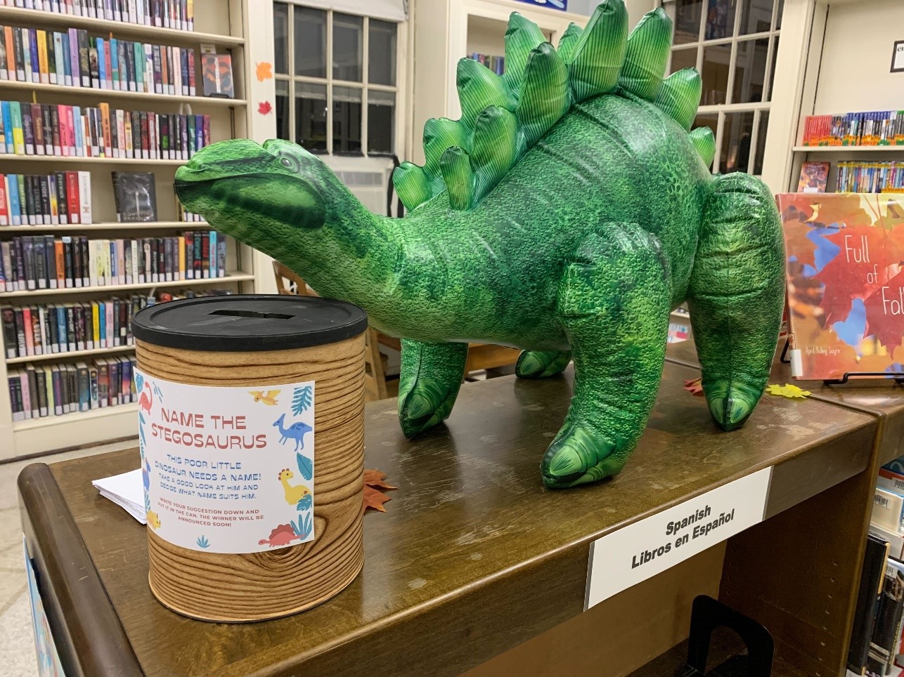 Name our dinosaur display at Dennis Branch Library in Newton