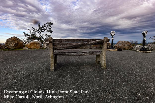 Broken bench with clouds overhead at High Point State Park